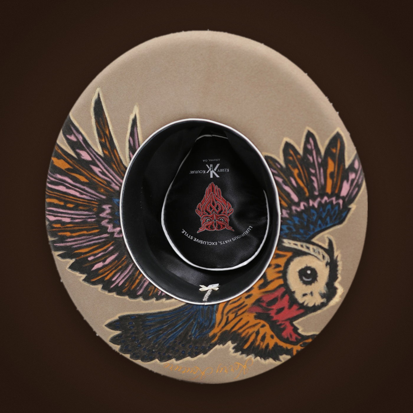 Signature owl under the bottom brim of the The Pontiac